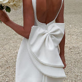 Robe courte trapèze sans manches à perles et nœud