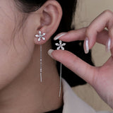 Boucles d'oreilles pendantes fleur et zircon