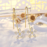 Boucles d'oreilles pendantes fleur et zircon