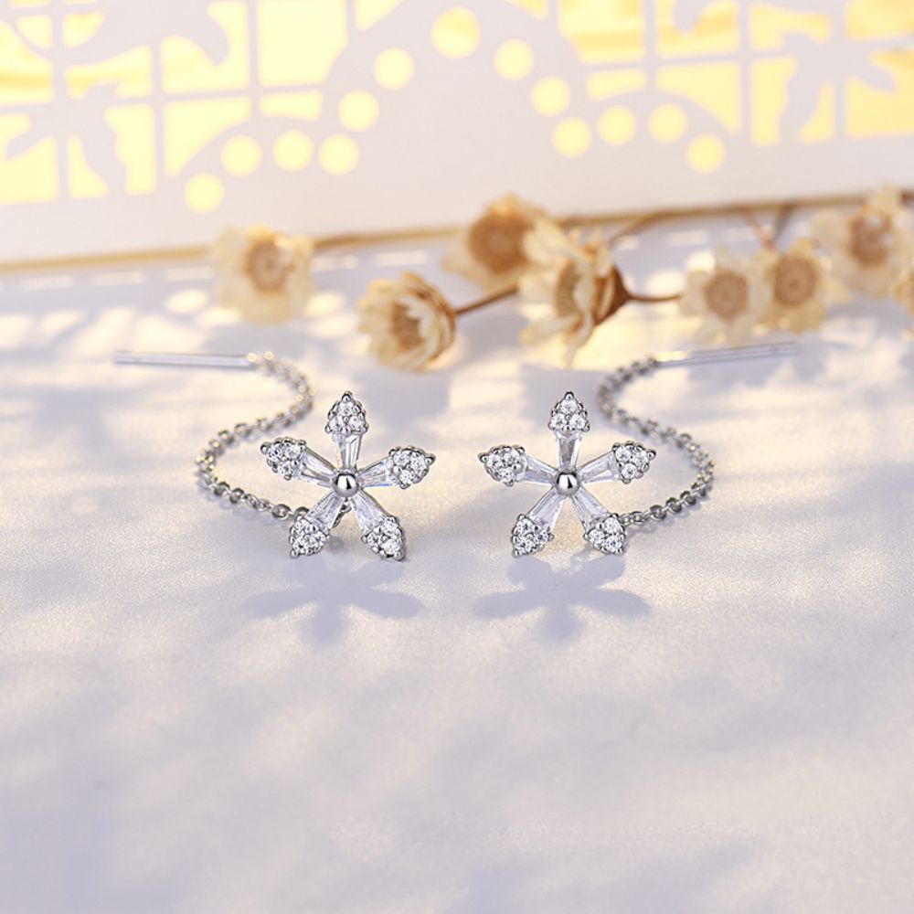Boucles d'oreilles pendantes fleur et zircon