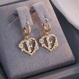 Boucles d'oreilles créoles cœur avec initiale, femme