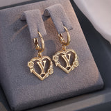 Boucles d'oreilles créoles cœur avec initiale, femme