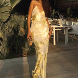 Robe Longue Satinée Fleurie Dos Nu Élégance Luxe