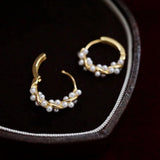 Boucles d'oreilles torsadées à détails de perle