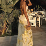 Robe Longue Satinée Fleurie Dos Nu Élégance Luxe