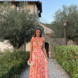 Robe longue fleurie à col V et volants