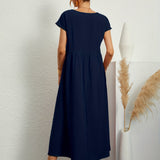 Robe Midi Unie à Col Rond