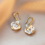 Boucles d'oreilles pendantes fleur dorées nacrées