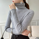 Pull femme col roulé en maille côtelée manches longues