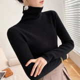Pull femme col roulé en maille côtelée manches longues