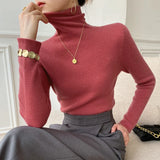 Pull femme col roulé en maille côtelée manches longues