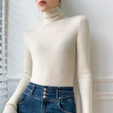 Pull femme col roulé en maille côtelée manches longues