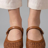 Mules plates femme en tressé à bride