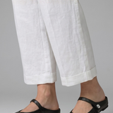 Mules plates femme en tressé à bride