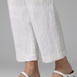 Mules plates femme en tressé à bride