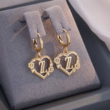 Boucles d'oreilles créoles cœur avec initiale, femme