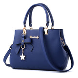Sac à main femme nœud et breloque étoile