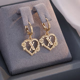 Boucles d'oreilles créoles cœur avec initiale, femme