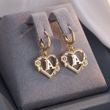 Boucles d'oreilles créoles cœur avec initiale, femme